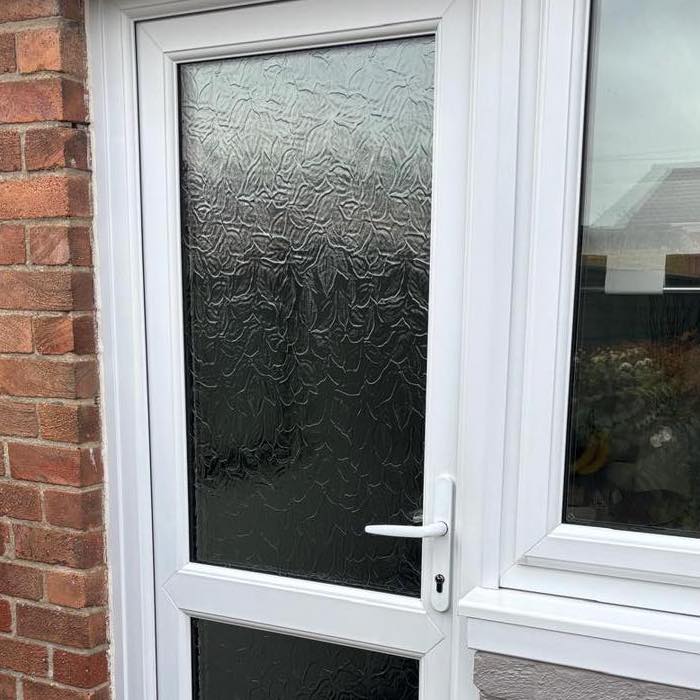 Patterned glass on a UPVC door.